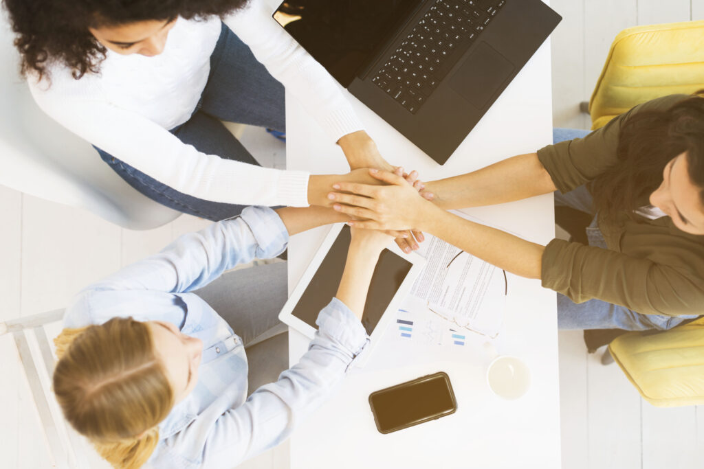 top-view-business-womens-shaking-hands-1024x683